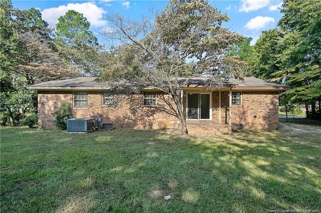 1001 Arberdale, Fayetteville, NC 28304 - back of house featuring brick siding, central AC unit, and a yard
