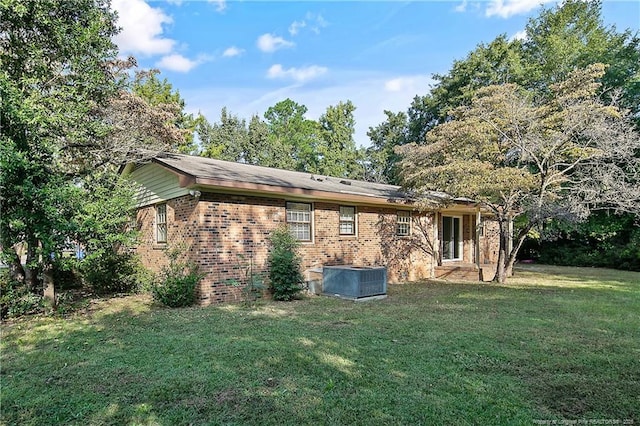 1001 Arberdale, Fayetteville, NC 28304 - back of house featuring a yard, brick siding, and central AC