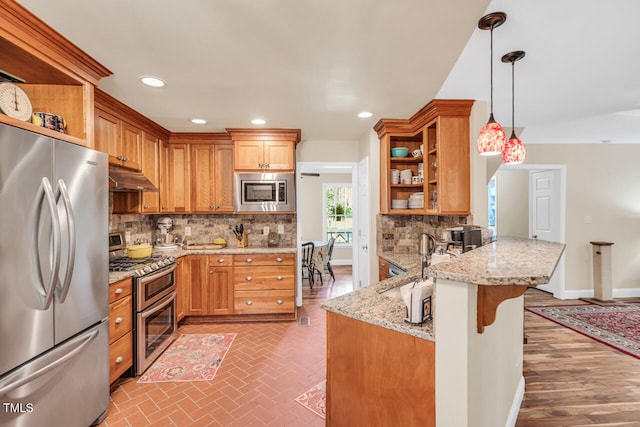11 Bridgeport Dr, Durham, NC 27713 - kitchen featuring open shelves, appliances with stainless steel finishes, under cabinet range hood, and a peninsula