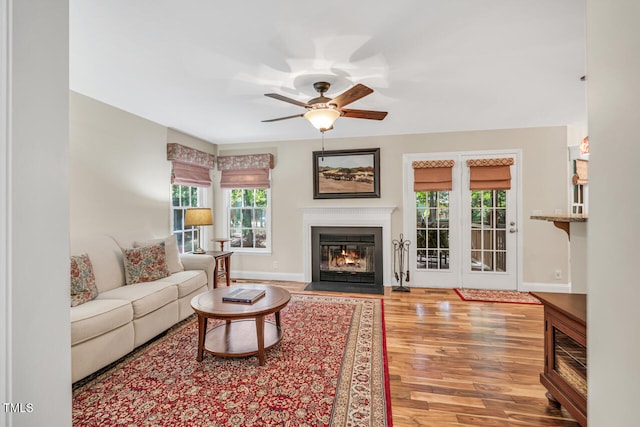 11 Bridgeport Dr, Durham, NC 27713 - living area with a ceiling fan, baseboards, a fireplace with flush hearth, and wood finished floors