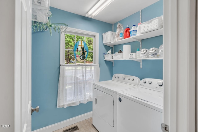 11 Bridgeport Dr, Durham, NC 27713 - laundry area featuring laundry area, visible vents, light wood-type flooring, baseboards, and separate washer and dryer