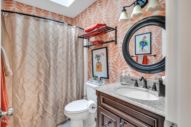 11 Bridgeport Dr, Durham, NC 27713 - full bathroom featuring a skylight, curtained shower, vanity, toilet, and wallpapered walls