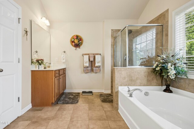 bathroom with vanity, baseboards, a stall shower, and a bath