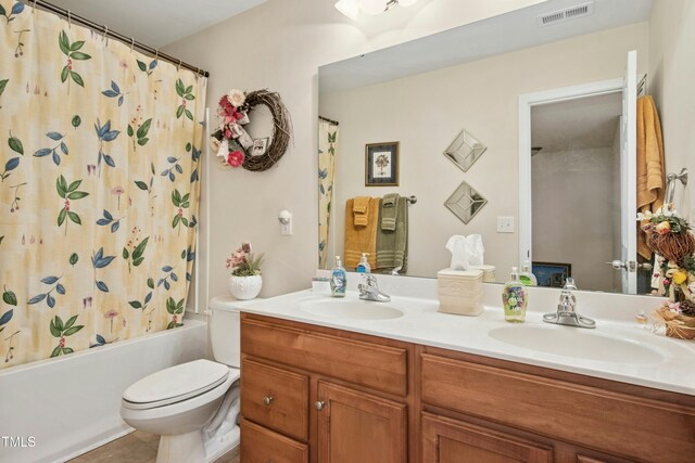 bathroom with visible vents, a sink, shower / tub combo with curtain, and double vanity