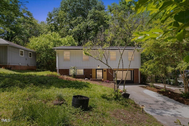 2904 Sprucewood Dr, Durham, NC 27707 - view of front facade with an attached garage, driveway, and brick siding
