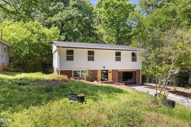 2904 Sprucewood Dr, Durham, NC 27707 - view of front of house with a front lawn and brick siding