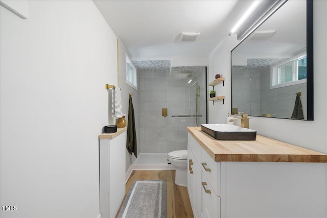 2904 Sprucewood Dr, Durham, NC 27707 - full bathroom with toilet, a shower stall, wood finished floors, and vanity