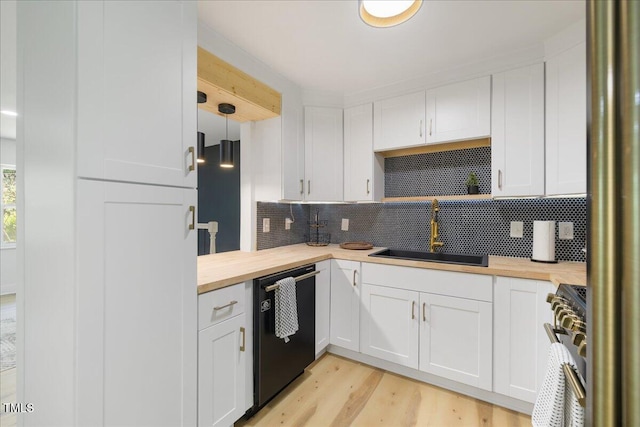 2904 Sprucewood Dr, Durham, NC 27707 - kitchen with stainless steel stove, tasteful backsplash, a sink, wood counters, and dishwasher