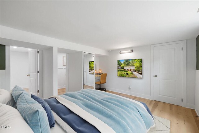 2904 Sprucewood Dr, Durham, NC 27707 - bedroom featuring baseboards and light wood-type flooring