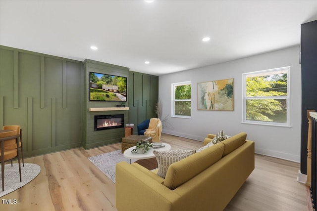 2904 Sprucewood Dr, Durham, NC 27707 - living area featuring baseboards, light wood finished floors, and a fireplace