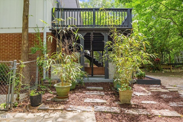 2904 Sprucewood Dr, Durham, NC 27707 - entrance to property with brick siding, fence, and a deck
