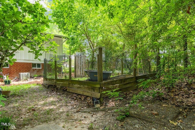 2904 Sprucewood Dr, Durham, NC 27707 - view of yard with central AC unit and a vegetable garden
