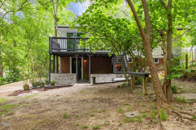 2904 Sprucewood Dr, Durham, NC 27707 - back of house featuring brick siding and a deck