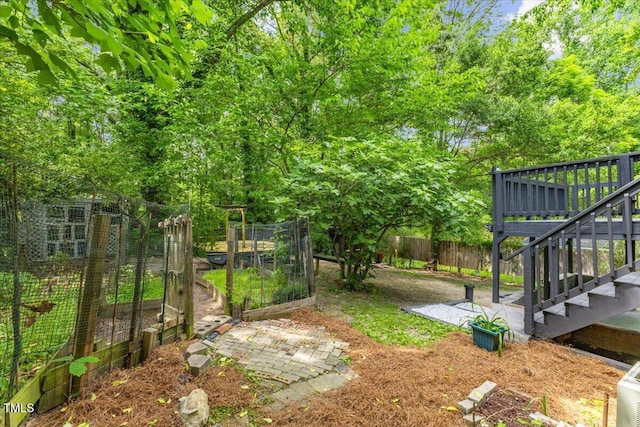 2904 Sprucewood Dr, Durham, NC 27707 - view of yard featuring stairs, a garden, and fence