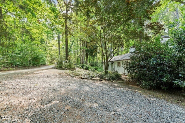 exterior space with a view of trees