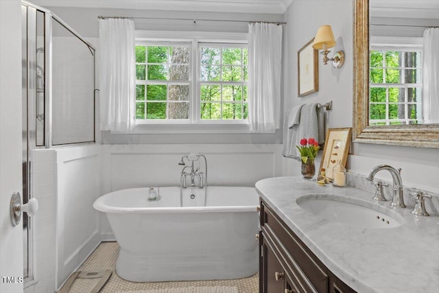 bathroom featuring vanity, tile patterned flooring, and a soaking tub