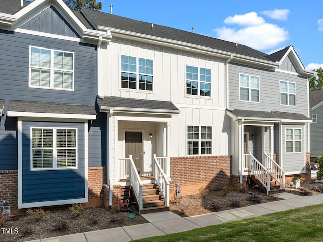 820 Laurel Gate Dr, Wake Forest, NC 27587 - view of front of home with brick siding, board and batten siding, and roof with shingles