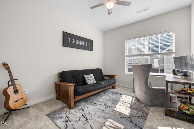 carpeted office with baseboards, a ceiling fan, and visible vents