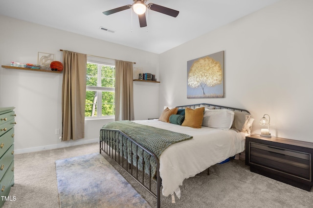 bedroom featuring baseboards, visible vents, ceiling fan, and carpet