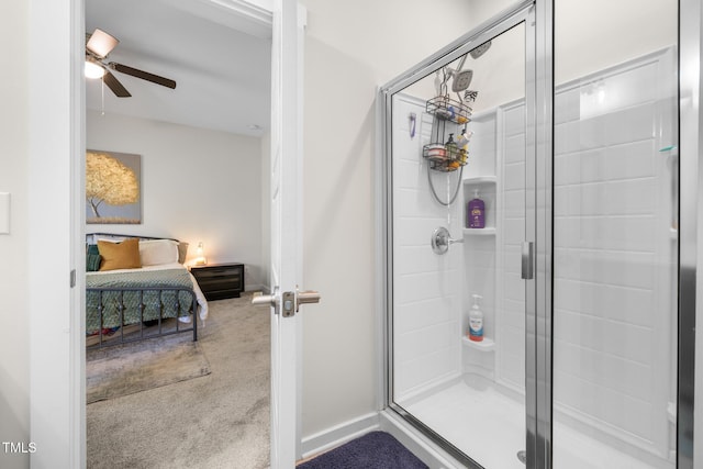 ensuite bathroom featuring ceiling fan, a shower stall, and ensuite bath