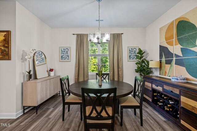 820 Laurel Gate Dr, Wake Forest, NC 27587 - dining space with baseboards, a chandelier, and wood finished floors