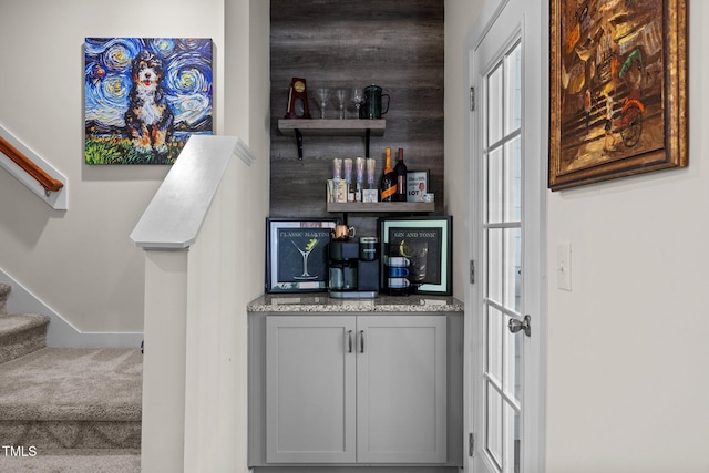 bar with a dry bar and stairway