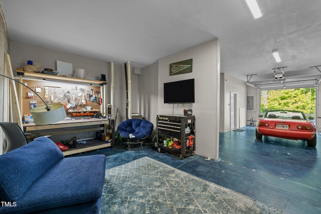 living area featuring a workshop area and finished concrete floors