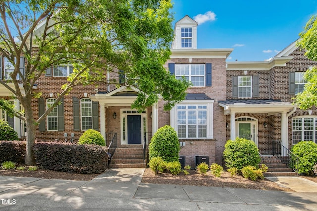 view of property with brick siding