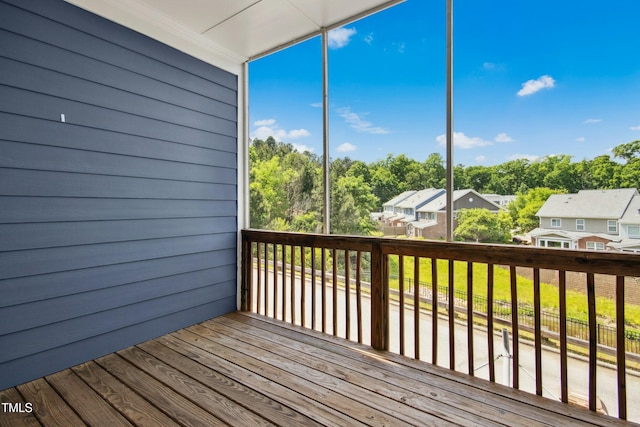 wooden terrace featuring a residential view