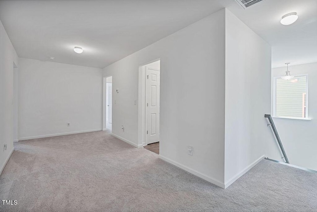 empty room with carpet flooring and baseboards