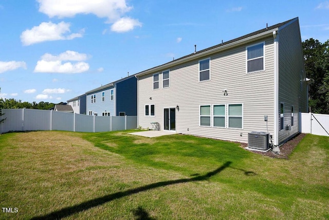rear view of house with a patio and central air condition unit