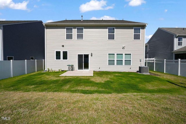 back of property with a patio and central AC