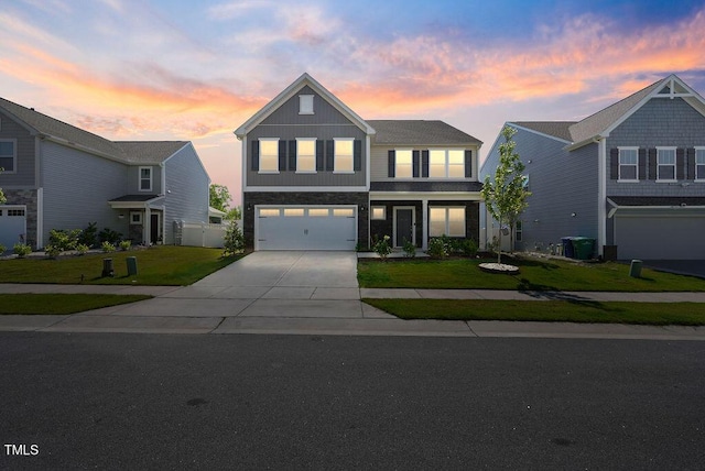 view of front of property with concrete driveway, a garage, a lawn, board and batten siding, and central air condition unit