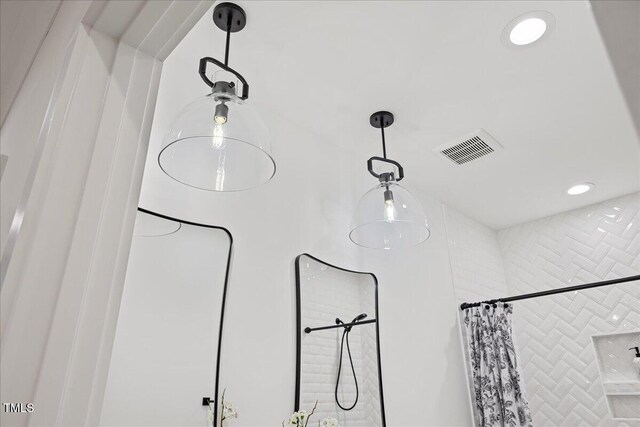 596 Oaks Lane Rd, Timberlake, NC 27583 - interior details featuring tiled shower and visible vents