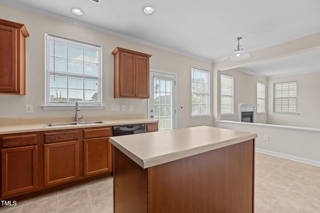 kitchen featuring a sink, a healthy amount of sunlight, and ornamental molding