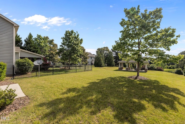 view of yard with a gazebo and fence