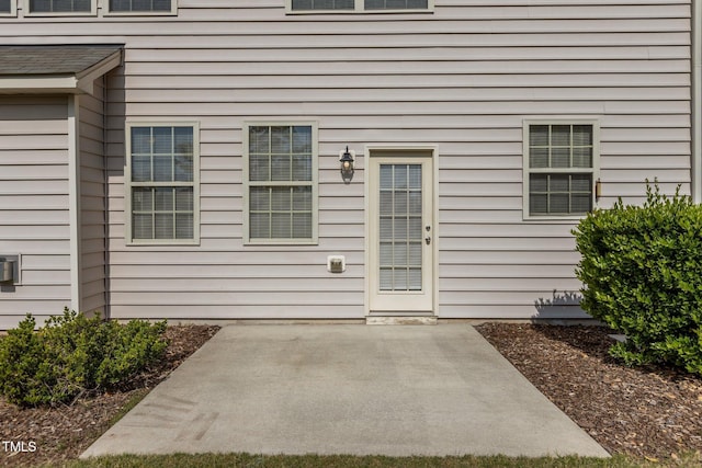 entrance to property with a patio area