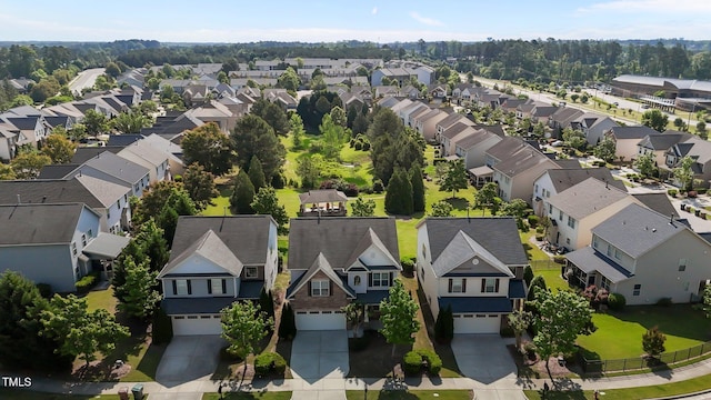 birds eye view of property with a residential view