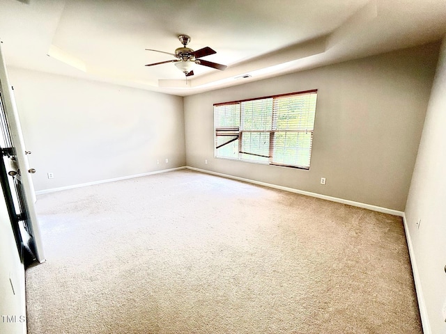 110 Bristolwood Cir, Morrisville, NC 27560 - empty room with a tray ceiling, carpet flooring, a ceiling fan, and baseboards
