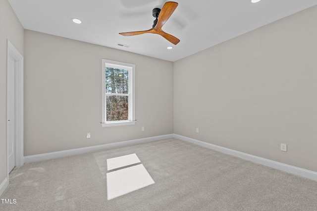 carpeted empty room with baseboards, a ceiling fan, recessed lighting, and visible vents