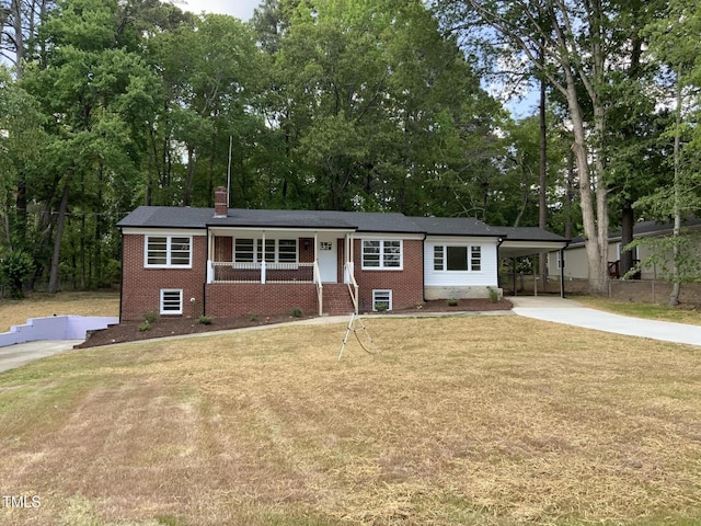 502 Burton St, Fuquay Varina, NC 27526 - single story home with brick siding, concrete driveway, an attached carport, and a chimney