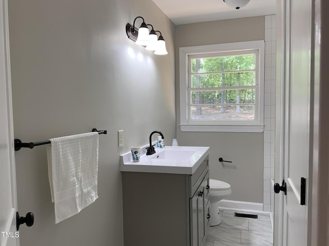 502 Burton St, Fuquay Varina, NC 27526 - bathroom with marble look tiles and vanity