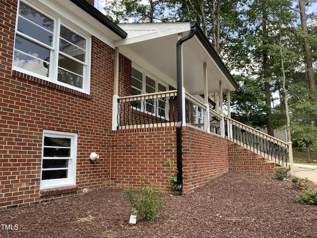 502 Burton St, Fuquay Varina, NC 27526 - view of property exterior featuring stairway and brick siding