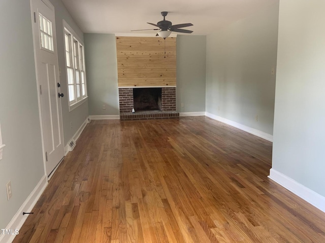 502 Burton St, Fuquay Varina, NC 27526 - unfurnished living room with ceiling fan, wood finished floors, and a fireplace