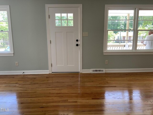 502 Burton St, Fuquay Varina, NC 27526 - foyer entrance featuring wood finished floors and baseboards