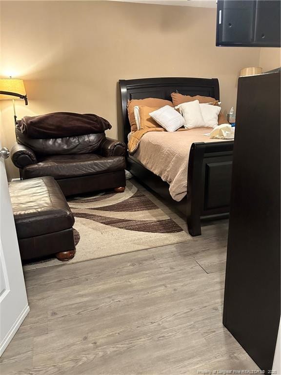 bedroom featuring wood finished floors
