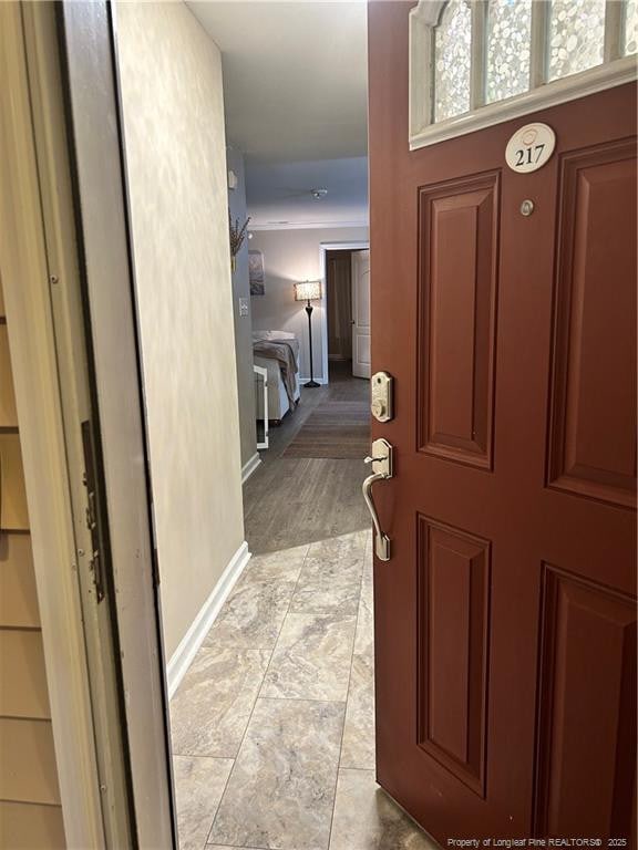 interior space featuring baseboards