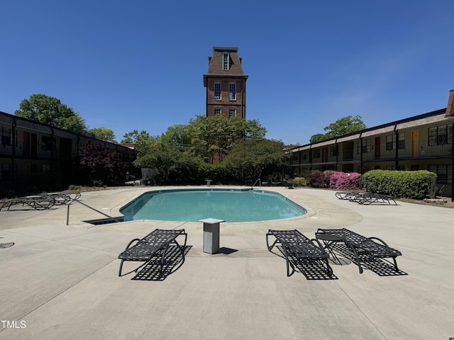 community pool featuring a patio area