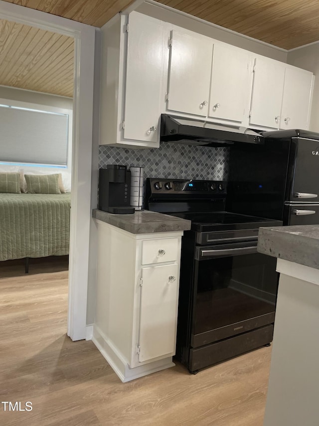 kitchen featuring wood ceiling, black electric range, tasteful backsplash, white cabinets, and under cabinet range hood