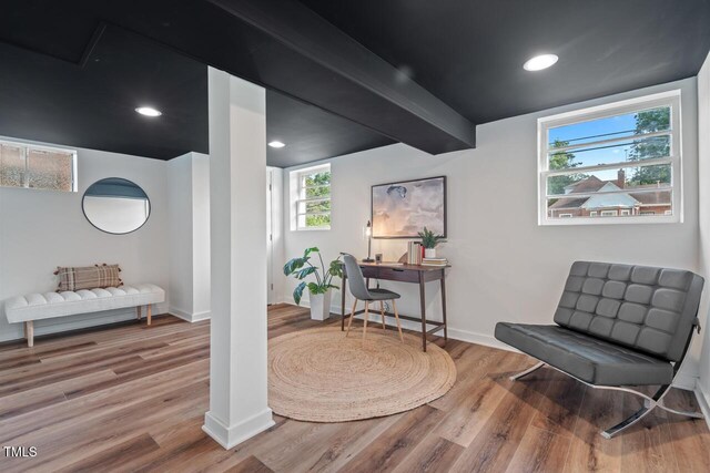 sitting room with baseboards, recessed lighting, and wood finished floors